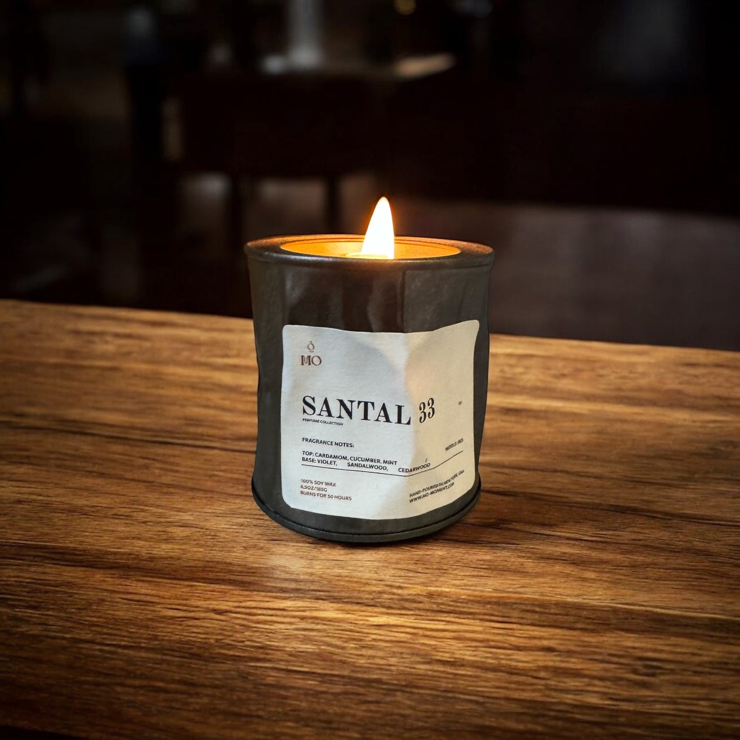 A scented candle made of soy wax in a crumpled metal tin. 6,5 oz